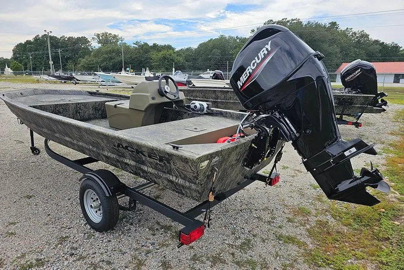 Slide: The Image of 2026 Tracker Grizzly 1648 SC boat with Mercury outboard engine on a trailer. - 3