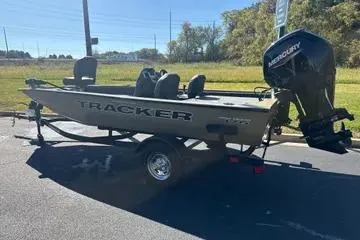 Slide: The Image of 2026 Tracker Pro Team 175 Crappie Edition boat with Mercury engine on trailer. - 3