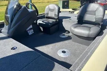 Slide: The Image of 2026 Tracker Pro Team 175 Crappie Edition boat interior with two seats and steering console. - 5