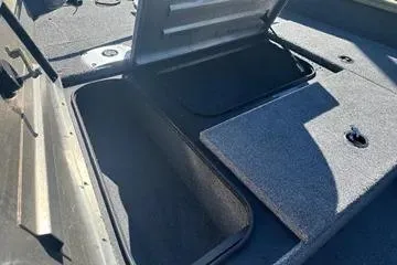 Slide: The Image of 2026 Tracker Pro Team 175 Crappie Edition boat storage compartments open. - 7