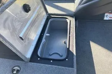 Slide: The Image of 2026 Tracker Pro Team 175 Crappie Edition boat storage compartment open. - 8