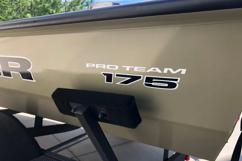 Slide: The Image of 2026 Tracker Pro Team 175 Crappie Edition boat side view with logo. - 10