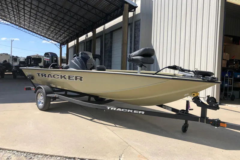 Slide: The Image of 2026 Tracker Pro Team 175 Crappie Edition boat on trailer outside a warehouse. - 5