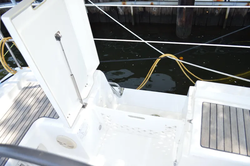 Slide: The Image of Beneteau Oceanis 34 (2012) yacht deck with open storage compartment. - 21