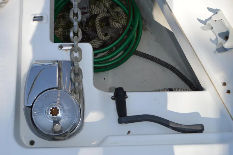Slide: The Image of Anchor chain and winch on 2012 Beneteau Oceanis 34 sailboat deck. - 25