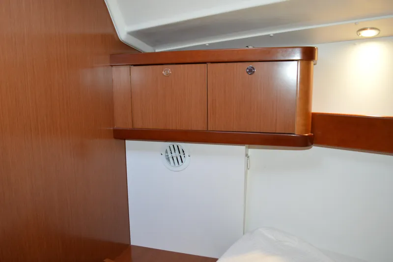 Slide: The Image of Interior cabin of 2012 Beneteau Oceanis 34, featuring wooden cabinetry and modern design. - 52