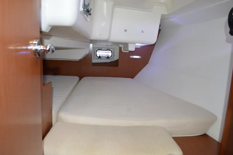Slide: The Image of Cozy cabin interior of 2012 Beneteau Oceanis 34 sailboat with comfortable bedding. - 54
