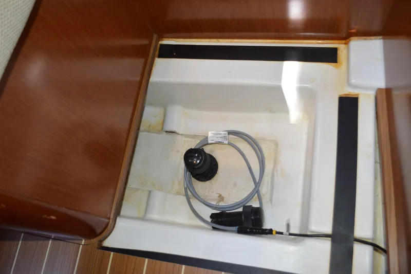 Slide: The Image of Storage compartment with cable in 2012 Beneteau Oceanis 34 sailboat interior. - 58