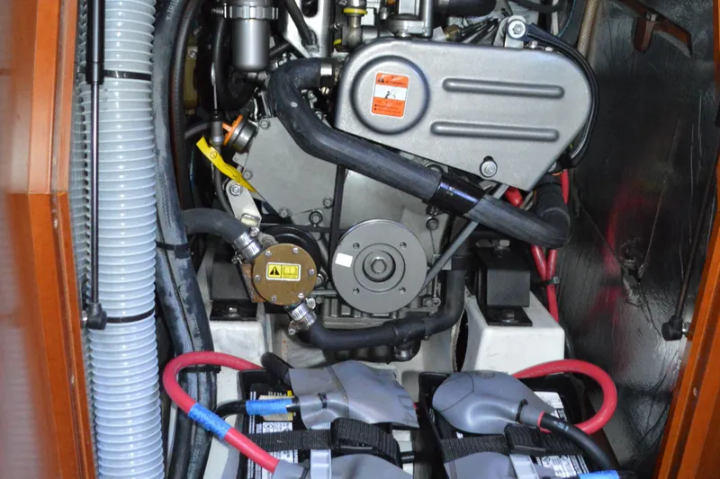 Slide: The Image of Engine compartment of a 2012 Beneteau Oceanis 34 sailboat, showcasing mechanical components. - 61