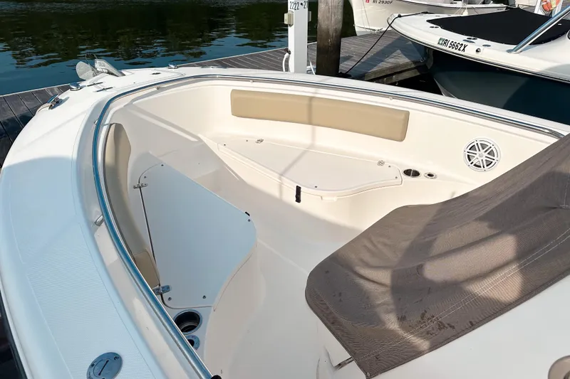 Slide: The Image of 2016 Pursuit C 238 Center Console boat interior with seating and storage. - 10