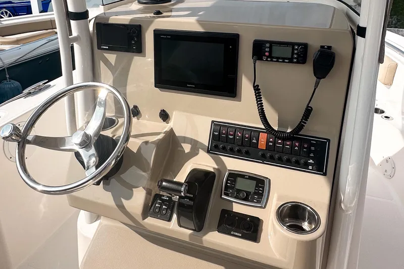 Slide: The Image of 2016 Pursuit C 238 Center Console dashboard with steering wheel and electronic controls. - 4