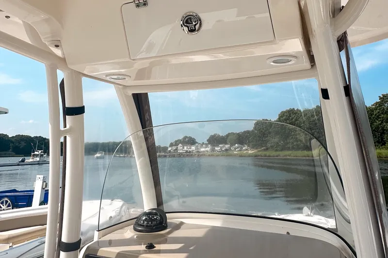 Slide: The Image of 2016 Pursuit C 238 Center Console boat interior with scenic water view. - 5