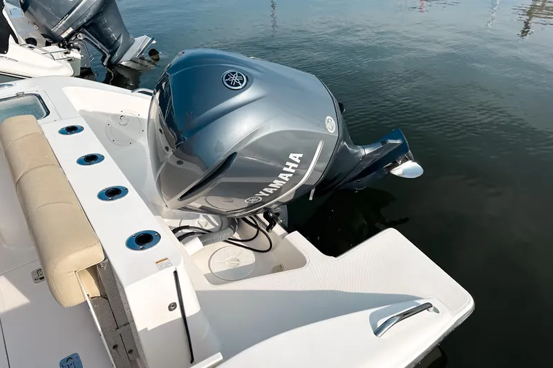Slide: The Image of 2016 Pursuit C 238 Center Console with Yamaha outboard engine on calm water. - 8