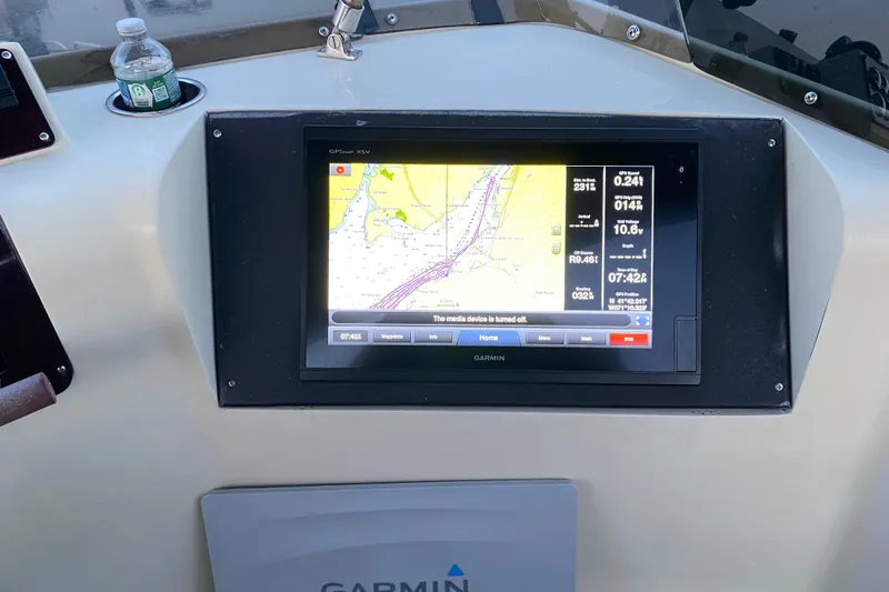 Slide: The Image of Garmin GPS display on 1989 Mainship Mediterranean Convertible boat dashboard. - 17