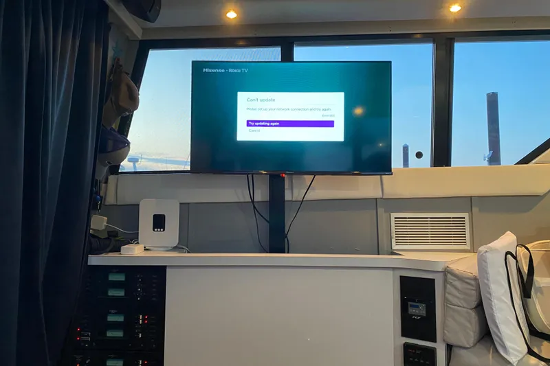 Slide: The Image of Interior of 1989 Mainship Mediterranean Convertible with TV displaying network error message. - 23