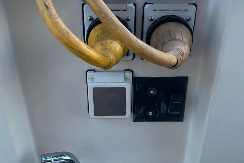 Slide: The Image of Electrical connections on a 1989 Mainship Mediterranean Convertible boat. - 25