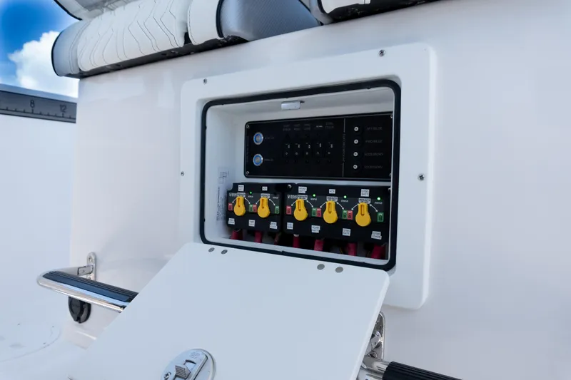 Slide: The Image of Electrical panel on 2025 Twin Vee 260 GFX2 CC boat, featuring control switches and wiring. - 17