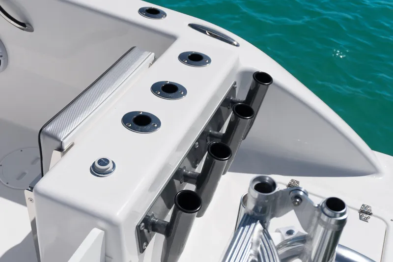 Slide: The Image of Close-up of 2025 Twin Vee 260 GFX2 CC boat's rod holders and deck details. - 23