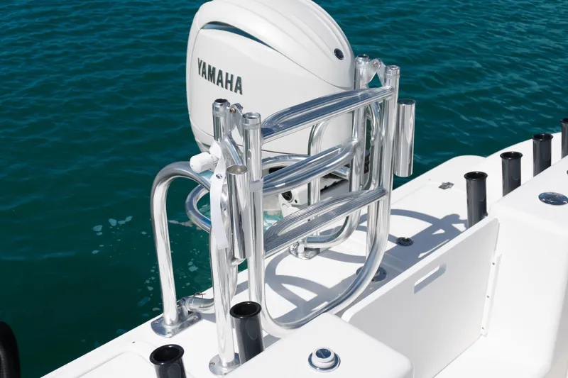 Slide: The Image of 2025 Twin Vee 260 GFX2 CC boat with Yamaha engine on clear blue water. - 24