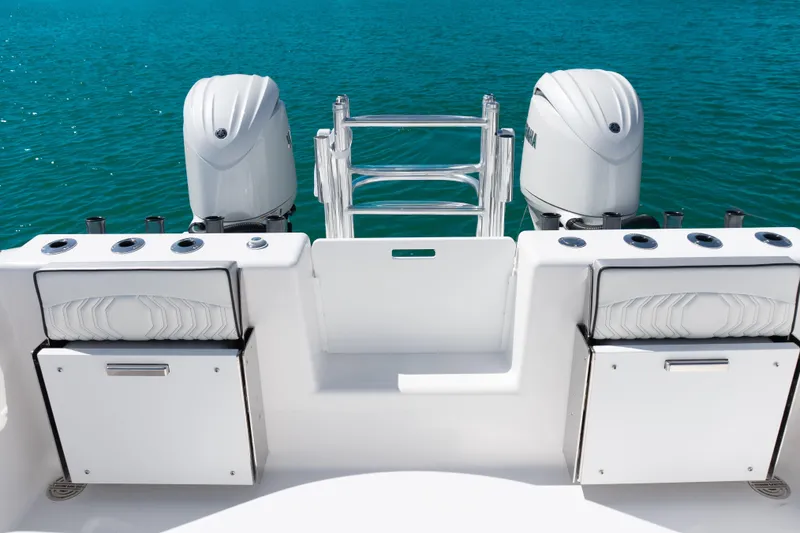 Slide: The Image of 2025 Twin Vee 260 GFX2 CC boat with dual engines on blue water. - 25