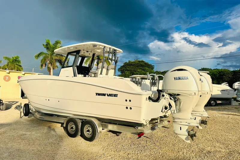 Slide: The Image of 2025 Twin Vee 260 GFX2 CC boat with Yamaha engines on a trailer. - 3