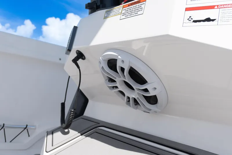 Slide: The Image of 2025 Twin Vee 260 GFX2 CC boat speaker and control panel, under clear blue sky. - 32