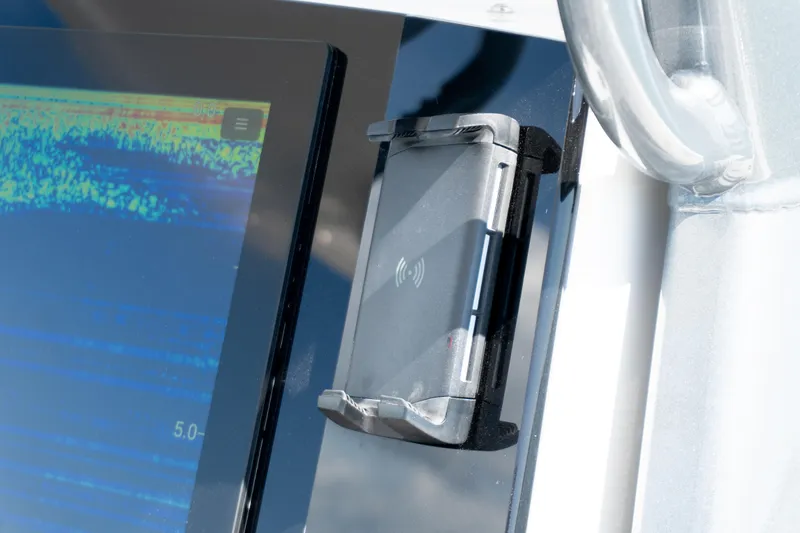 Slide: The Image of Close-up of 2025 Twin Vee 260 GFX2 CC dashboard with electronic display and device holder. - 33