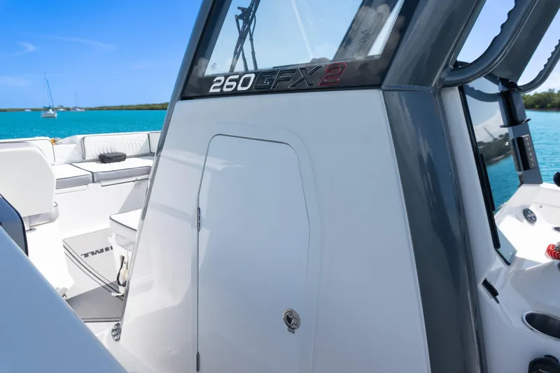 Slide: The Image of 2025 Twin Vee 260 GFX2 CC boat interior with ocean view and sleek design. - 35