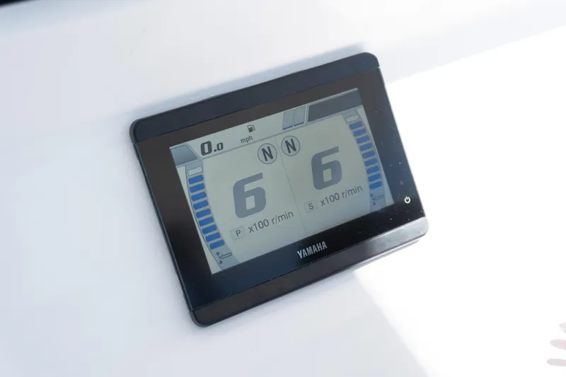 Slide: The Image of Yamaha display on 2025 Twin Vee 260 GFX2 CC boat, showing engine RPM and speed. - 36