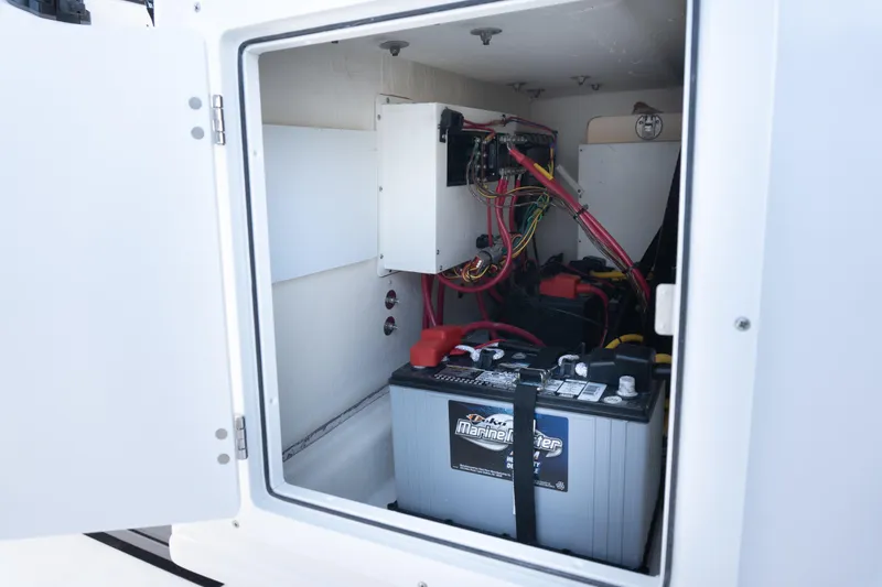 Slide: The Image of Battery compartment of 2025 Twin Vee 260 GFX2 CC boat, showing wiring and connections. - 38