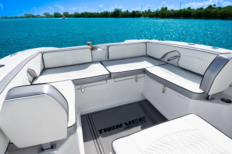 Slide: The Image of Luxurious seating on 2025 Twin Vee 260 GFX2 CC boat, with scenic water view. - 6