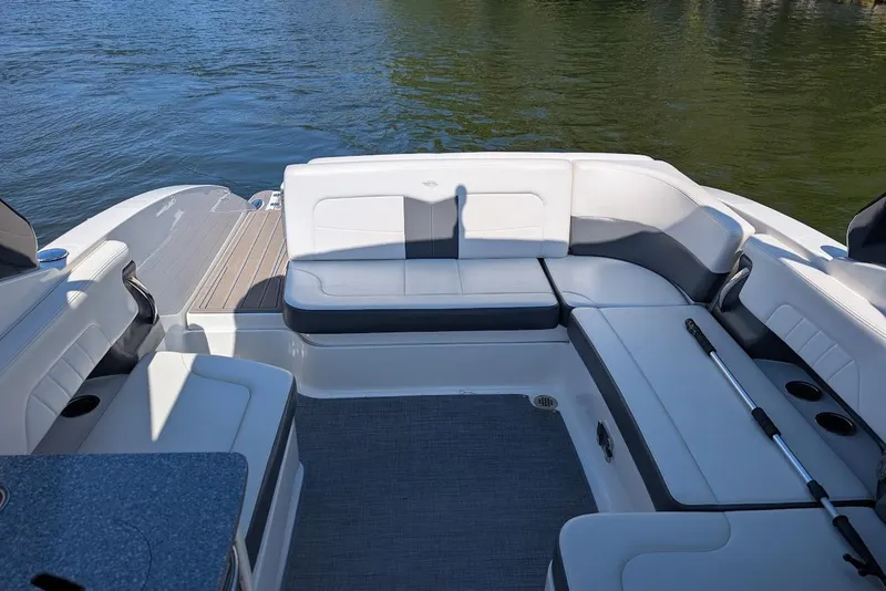 Slide: The Image of 2016 Chaparral 307 SSX boat interior with spacious seating and water view. - 19