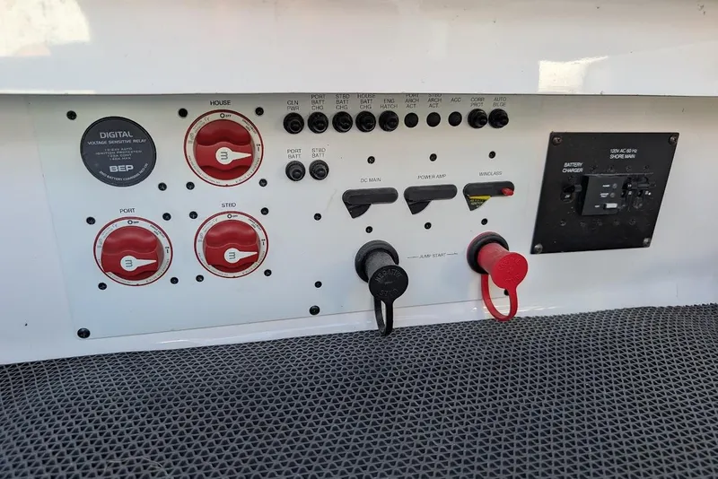 Slide: The Image of Control panel of a 2016 Chaparral 307 SSX boat with switches and dials. - 28