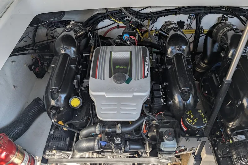 Slide: The Image of Engine compartment of a 2016 Chaparral 307 SSX boat, featuring a 350 MAG engine. - 30
