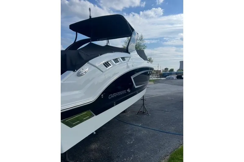 Slide: The Image of 2016 Chaparral 307 SSX boat on display under a partly cloudy sky. - 33
