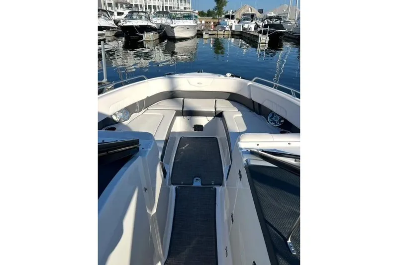Slide: The Image of 2016 Chaparral 307 SSX boat interior with seating, docked at marina. - 6