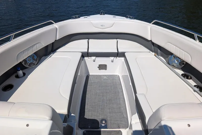 Slide: The Image of 2016 Chaparral 307 SSX boat interior with spacious seating and cup holders. - 7