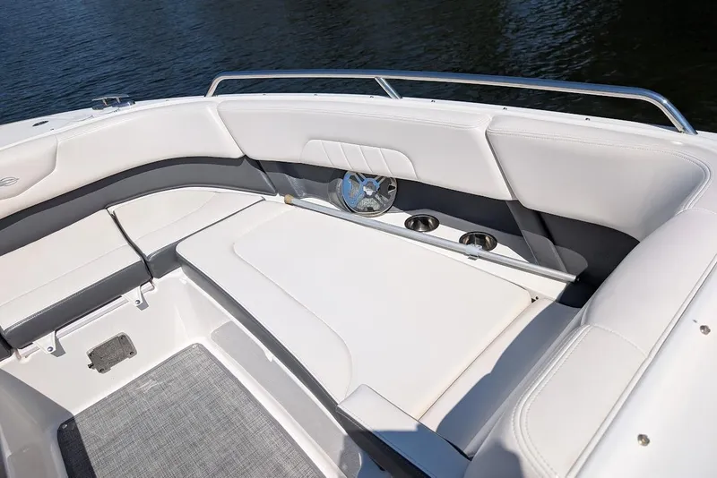 Slide: The Image of 2016 Chaparral 307 SSX boat interior with white seating and cup holders. - 8