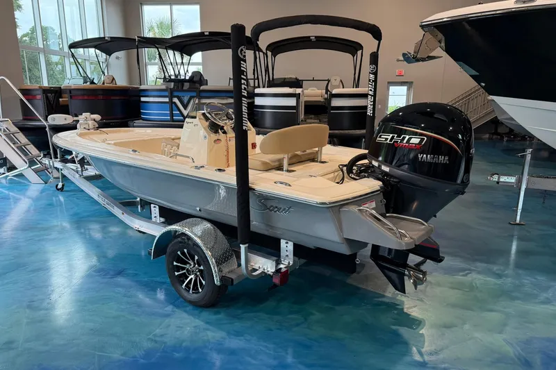 Slide: The Image of 2026 Scout 177 XSS boat with Yamaha engine displayed in showroom. - 2