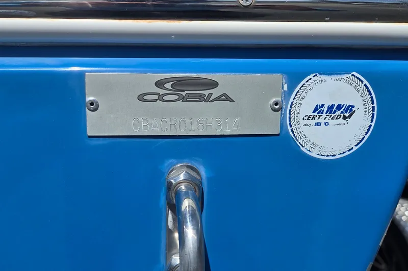 Slide: The Image of 2014 Cobia 217 Center Console boat identification plate and certification sticker. - 16