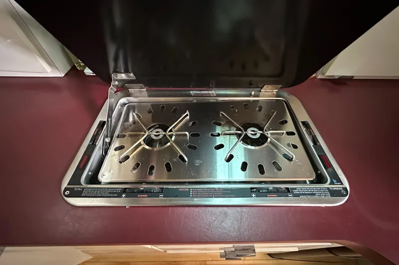 Slide: The Image of Stainless steel stove in 1990 Silverton 34 Express boat kitchen. - 34