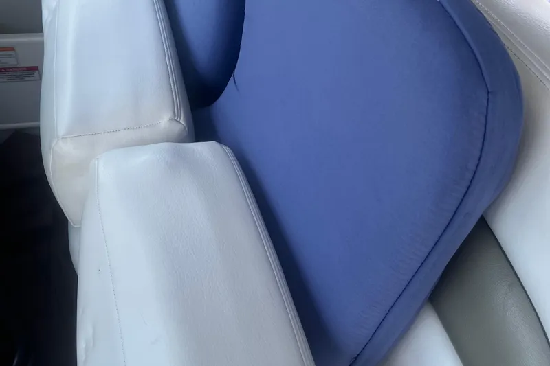 Slide: The Image of White and blue seating on a 2007 Sea Ray 300 Sundancer boat. - 13