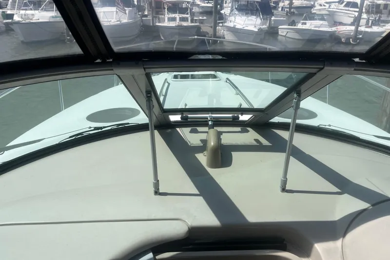 Slide: The Image of 2007 Sea Ray 300 Sundancer boat interior with marina view through windshield. - 5