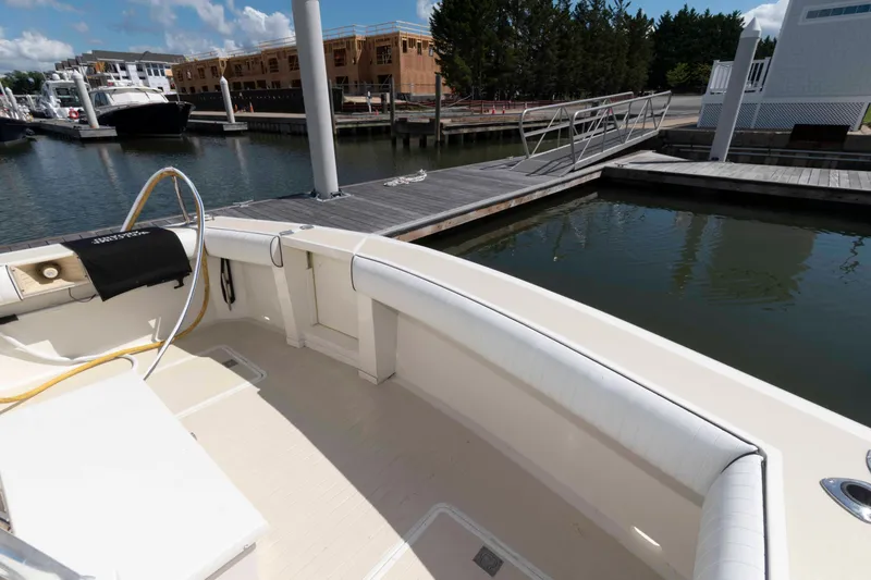 Slide: The Image of 1990 Viking 50 Motor Yacht docked at marina, featuring spacious deck and modern amenities. - 14