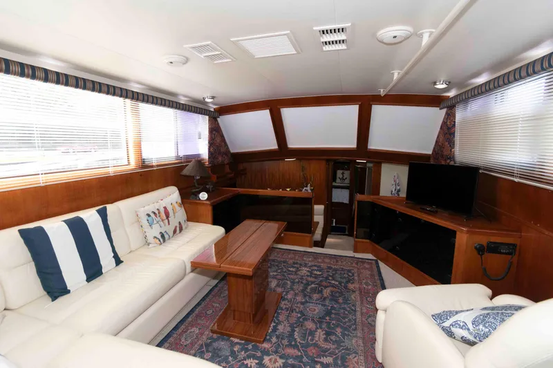 Slide: The Image of Luxurious interior of 1990 Viking 50 Motor Yacht with elegant seating and decor. - 17