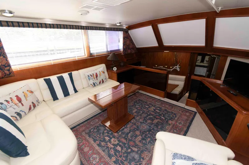 Slide: The Image of Luxurious interior of 1990 Viking 50 Motor Yacht with elegant seating and decor. - 18