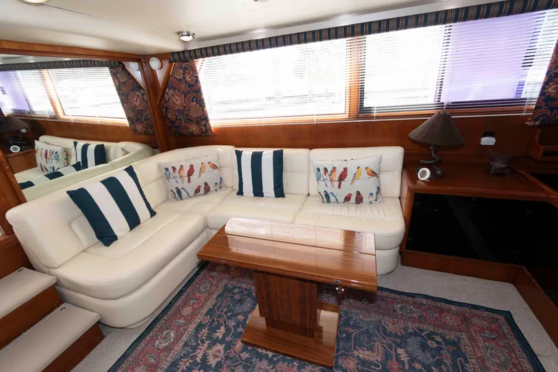 Slide: The Image of Luxurious 1990 Viking 50 Motor Yacht interior with elegant seating and decorative cushions. - 19