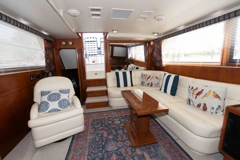 Slide: The Image of Luxurious interior of 1990 Viking 50 Motor Yacht with plush seating and elegant decor. - 20