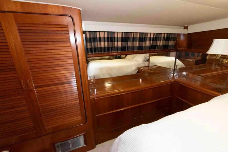 Slide: The Image of Luxurious wooden interior of 1990 Viking 50 Motor Yacht bedroom. - 28