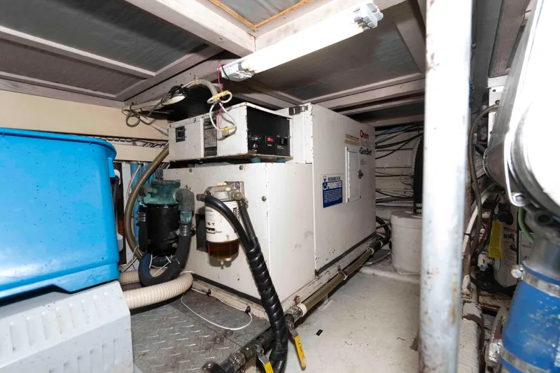 Slide: The Image of Engine room of 1990 Viking 50 Motor Yacht with Onan generator and equipment. - 38